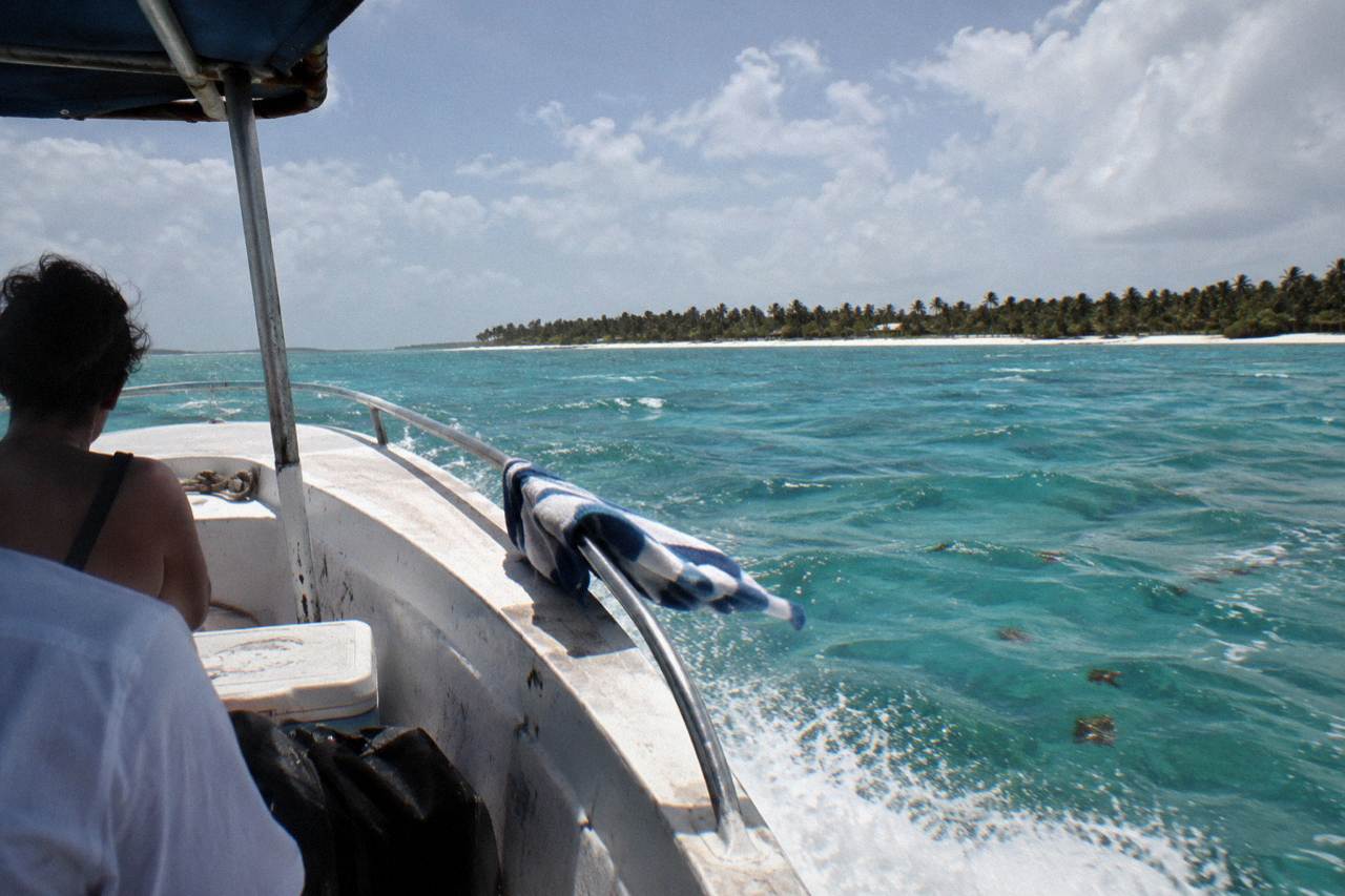 Speedboat crossing open turquoise Caribbean water toward Saona Island