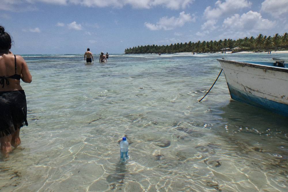 Shallow clear water over a sandy bottom at a natural pool sandbar