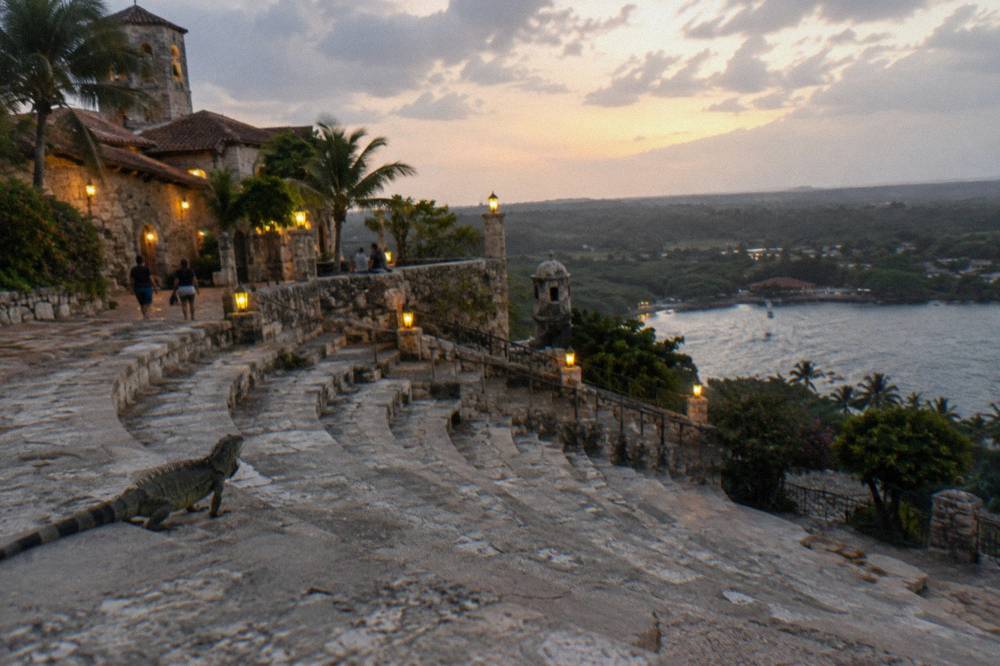 Old stone amphitheater overlooking a river valley at dusk