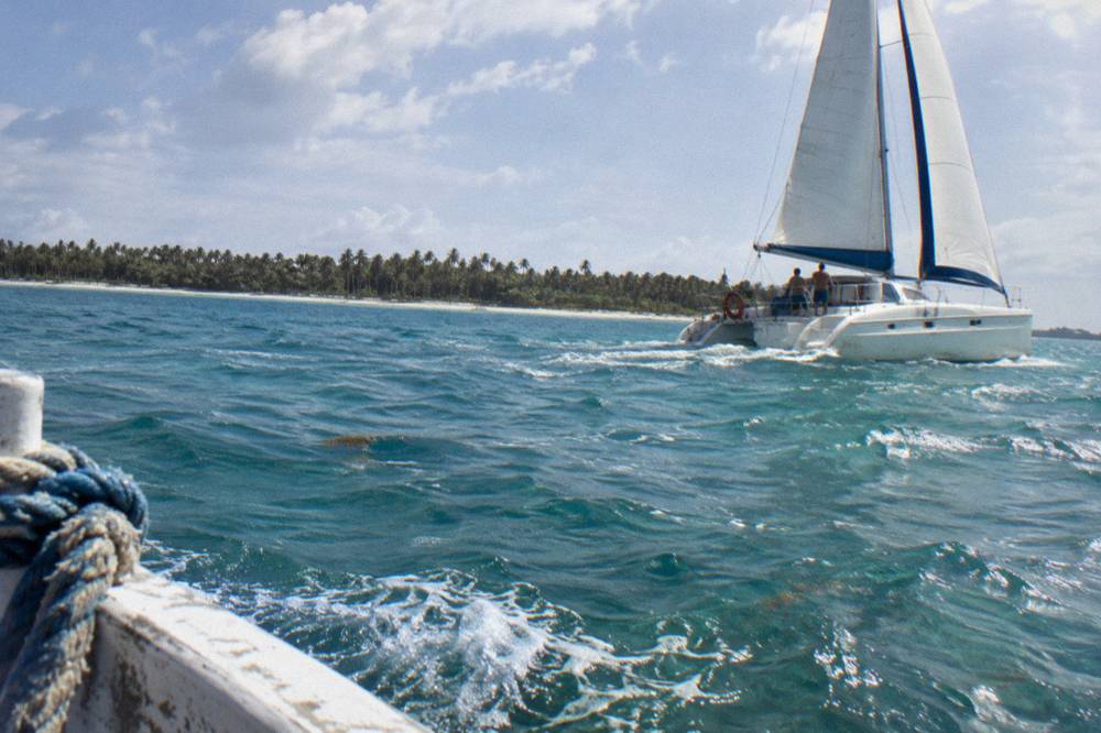Catamaran under sail on open turquoise Caribbean water