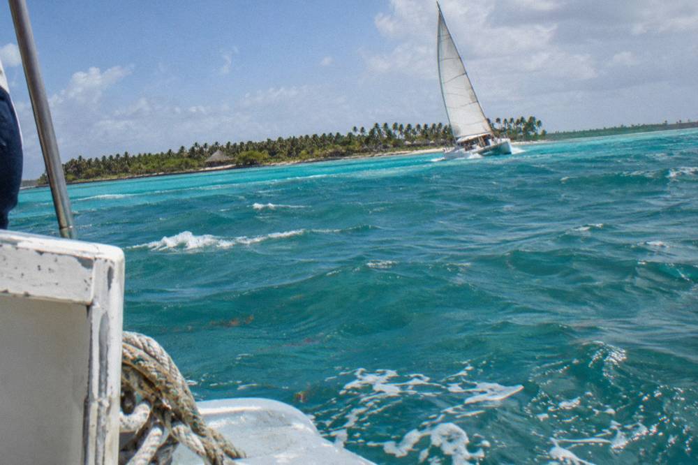 Catamaran under sail on open turquoise Caribbean water